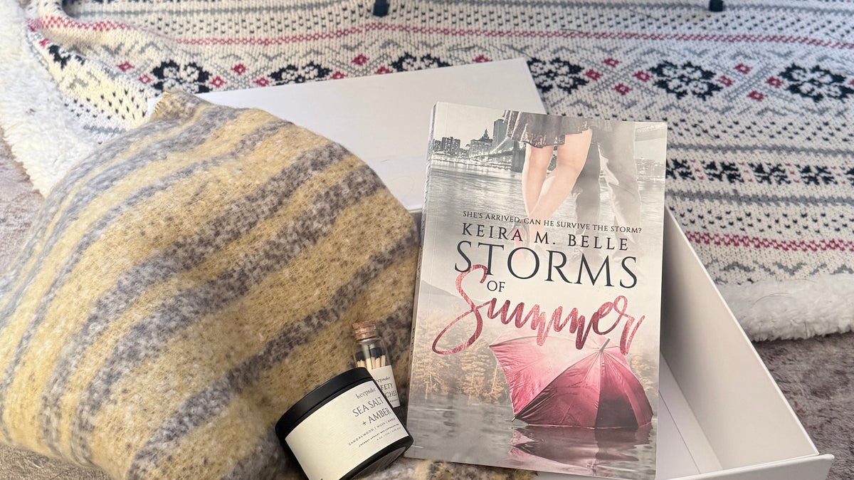 Sage & Arrow Holiday Gift Box with a book, candle, matches, and a cozy winter scarf